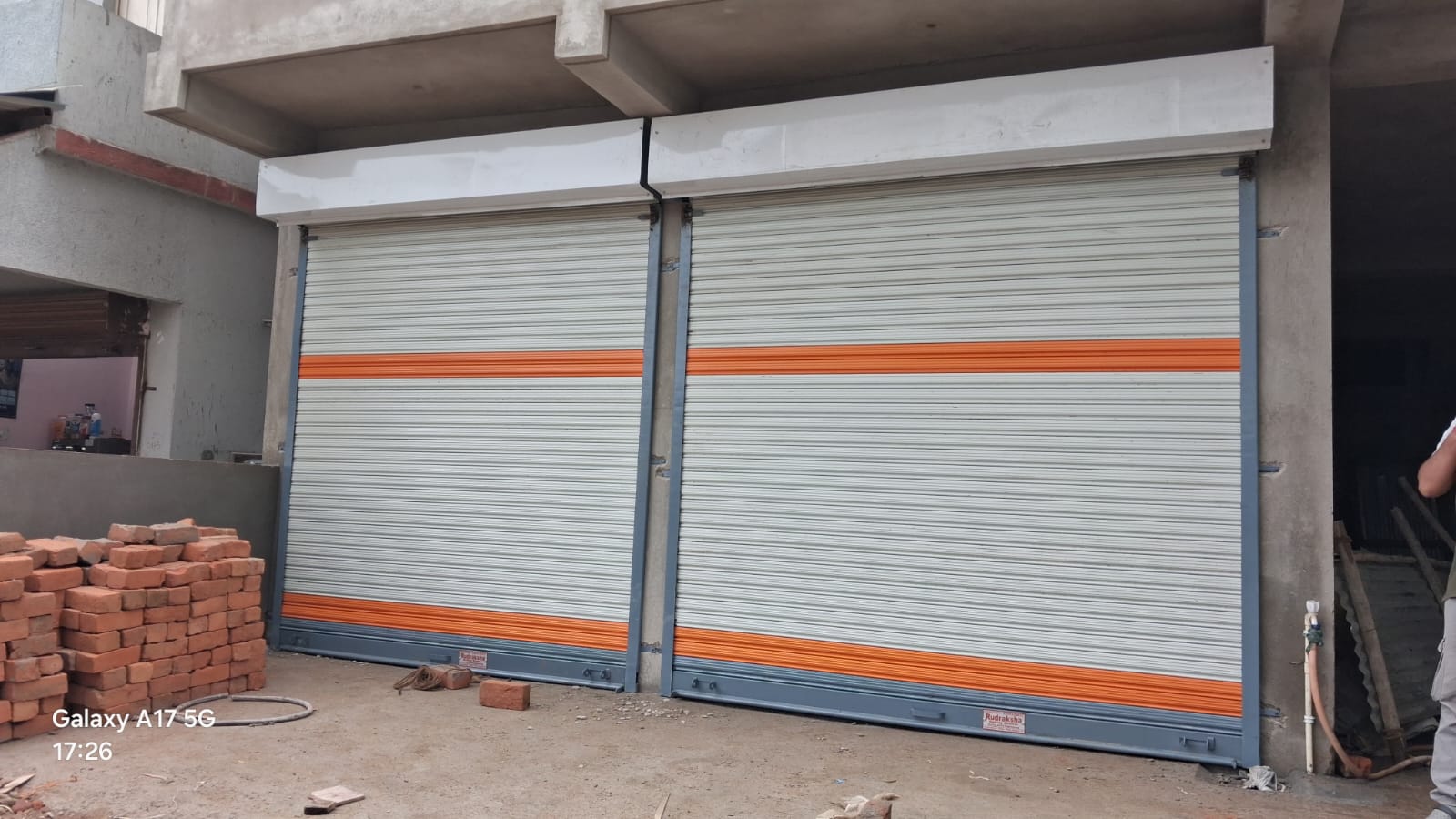 Twin orange stripe rolling shutters, Nagpur